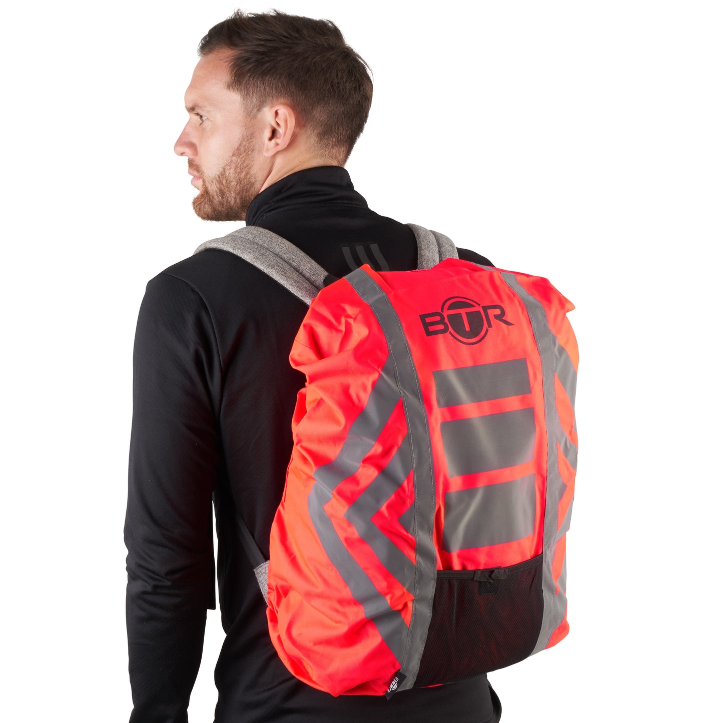 BTR red waterproof hi vis backpack cover worn by a cyclist