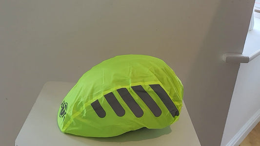 BTR hi vis helmet cover fitted on a youth cycling helmet