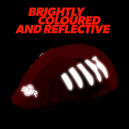 BTR red bike helmet cover glowing in the dark with reflective strips