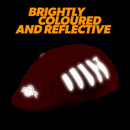 BTR orange bike helmet cover glowing in the dark with reflective strips