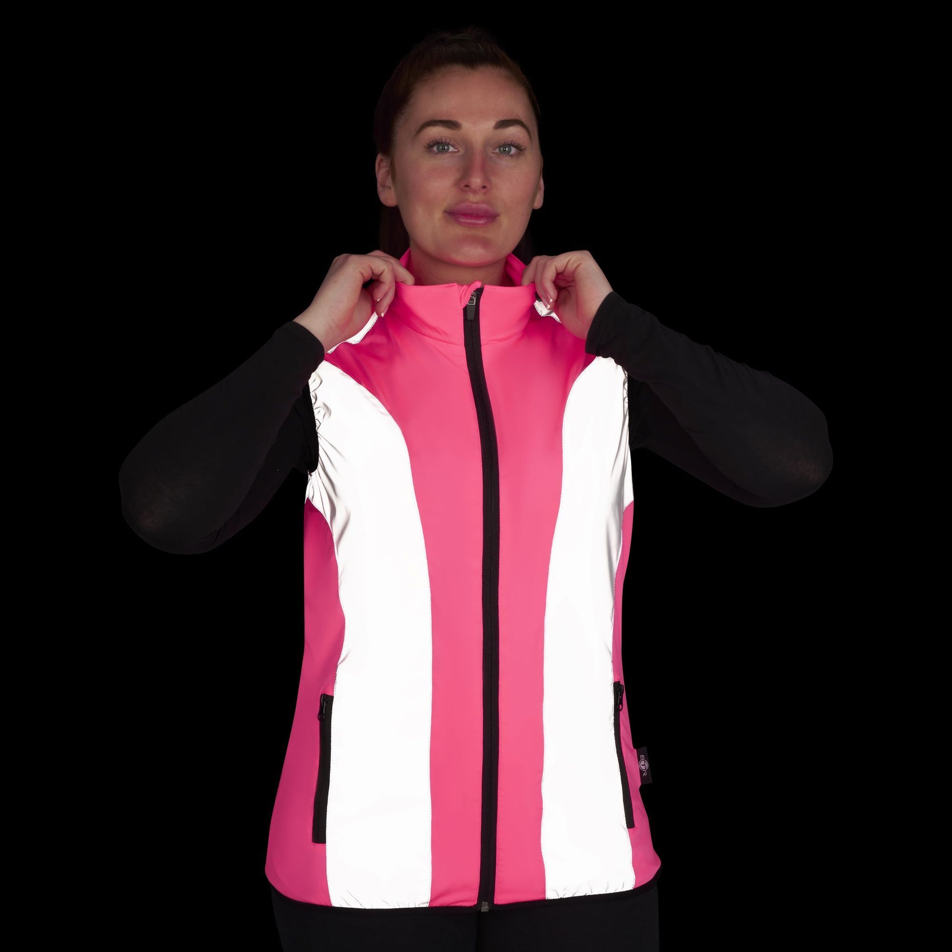 BTR womens pink hi vis gilet worn at night with reflective panels