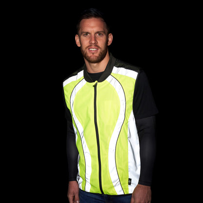 BTR yellow and silver gilet reflecting bright white in the dark, worn by a man
